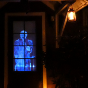 Digital Halloween decoration projected onto a home's front door to create a haunted schoolhouse